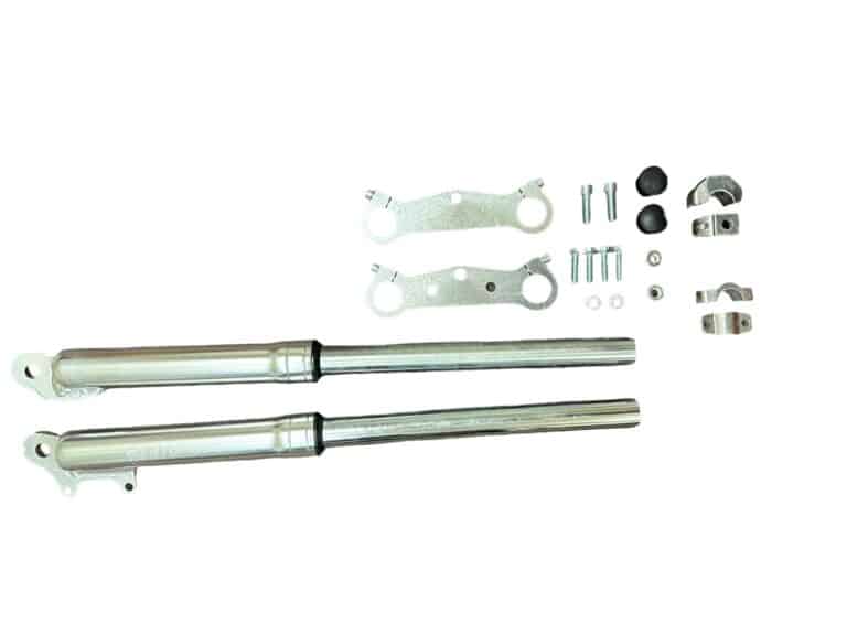 Assorted metal automotive parts arranged on a white background, including Front Fork QG-50 (FO-23) (MGM-CA012) and small hardware components.